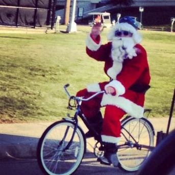 Santa Claus bikes across the campus of the University of North Texas.