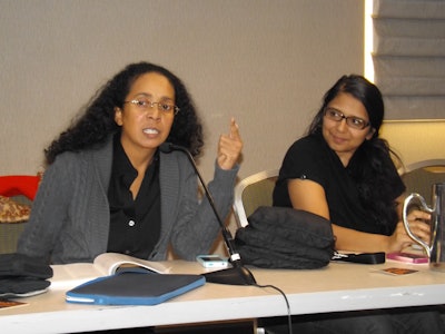 Hofstra University’s Dr. Jennifer Henton, left, presents with Rollins College’s Dr. Vidhu Aggarwal at the MLA convention yesterday.