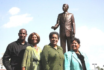 The Evers family gathers at the bronze statue of the late civil rights activist Medgar Evers on the Alcorn State campus.