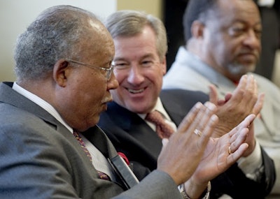 President William H. Harris (left) and Montgomery mayor Todd Strange (r) applaud during a 2011 press conference held by the National Park Service announcing ASU as the official Montgomery site for the Selma to Montgomery March Interpretative Center. Photo by David Campbell/ASU