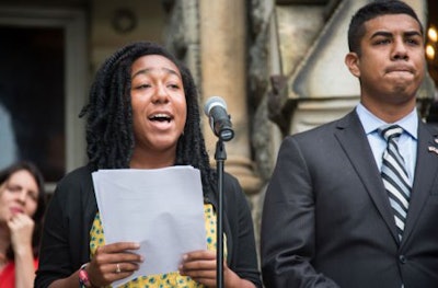 Amanda Wynter (C’14) reads an excerpt from “I Have a Dream” as Adan Gonzalez (C’15) stands by. (photo courtesy of Georgetown University)