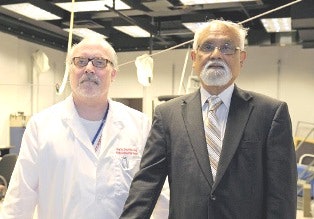 Dr. Kim Dietrich, left, and Dr. Amit Bhattacharya are investigating the effect of childhood lead exposure on bone and musculature health later in life in African-American women. (Photo courtesy of the University of Cincinnati)