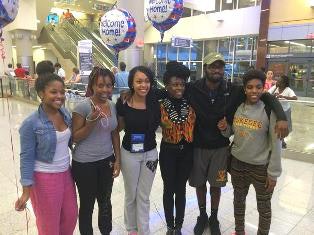 The six Tuskegee University students who were stranded in Liberia were greeted by Atlanta-area alumni, the student government president and others upon their return to the Atlanta airport. (Photo courtesy Tuskegee University)