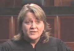U.S. District Judge Virginia Kendall said a jury should decide whether Kennedy-King College discriminated against Thomas Rasheed in 2001.