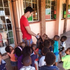 Program participant Clint Brayfield, a Native American student from Robertson High School in Las Vegas, New Mexico, and a member of the 2010 BA/MD Cohort, volunteered at an orphanage this year in Port Elizabeth, South Africa. (Photo courtesy of the University of New Mexico)