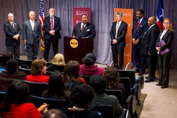 Dr. Larry L. Earvin, president and CEO of Huston-Tillotson, announces the partnership as Dr. S. Claiborne “Clay” Johnston, dean of the Dell Medical School at The University of Texas at Austin, looks on from his left. (Photo courtesy of Huston-Tillotson University/University of Texas at Austin)