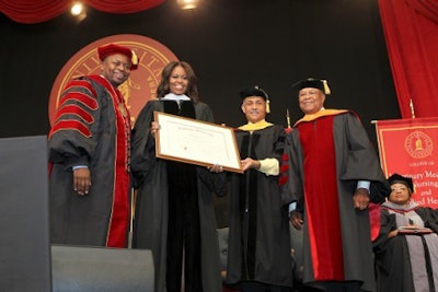 Dr. Brian L. Johnson, president of Tuskegee University (left), presents First Lady Michelle Obama with an honorary degree. (Photo courtesy of Tuskegee University)