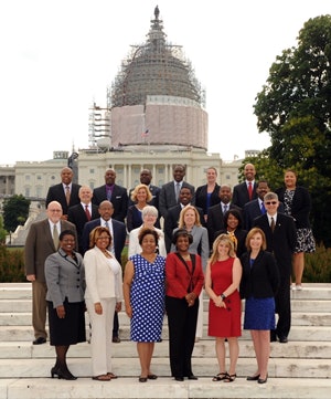 This year’s American Association of State Colleges and Universities (AASCU) MLI Institute protégés stand in front of the U.S. Capitol. (Photo by Peter Cutts/AASCU)