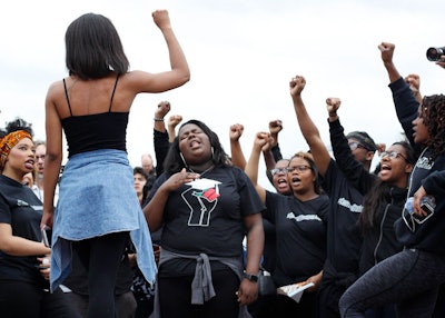 Members and supporters of the student activist group Concerned Student 1950 chant during a march across the University of Missouri campus on March7in Columbia, Mo. (Liv Paggiarino/Missourian via AP)