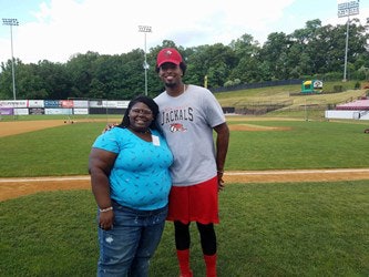 Habirah Williams, a participant in the program for high school students, interviews Jackals Infielder Art Charles.