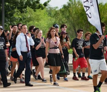 Dr. Cynthia Teniente-Matson, president of Texas A&M University-San Antonio, leads the Jaguar March on campus, celebrating the start of the year for the university’s first roster of freshmen.