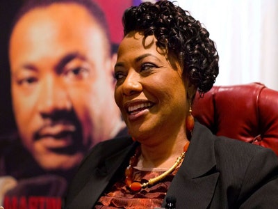 Dr. Bernice King, daughter of Dr. Martin Luther King Jr., speaks during an interview in front of an image of her father at the King Center in Atlanta.