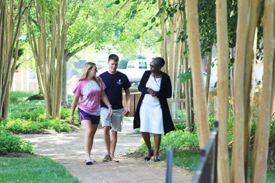 Dr. Tuajuanda C. Jordan, right, talks with students on the campus of St. Mary’s College in Maryland. (Photo courtesy of St. Mary’s College)