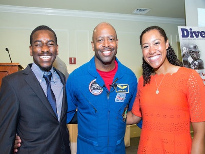 From left: Paul Sime of the University of Kentucky, Leland Melvin and Nicole Evans at the Arthur Ashe Jr. Sports Scholars awards luncheon Tuesday. (Photo by Kim Schmidt)
