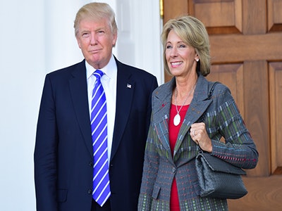 President Donald J. Trump signed an executive order Wednesday that directs U.S. Secretary of Education Betsy DeVos, right, to study whether the Department of Education has overstepped its authority.
