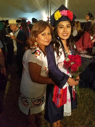 Maria Rodriguez celebrates with her daughter Cynthia Diaz at graduation.