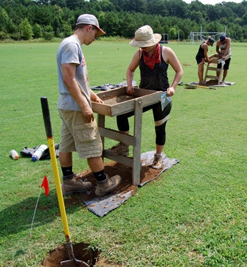 Students excavate the remains of what could be slave quarters beneath the athletic fields at St. Mary’s College. (Photo courtesy of St. Mary’s College of Maryland)