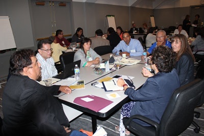 Tribal College and University presidents engage in a group discussion.