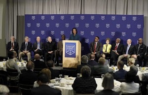 Condoleezza Rice flanked by members of the Commission on College Basketball.