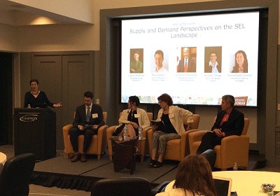 Dr. Catherine Millett of ETS moderates a panel at the “Springboard for Success” conference.