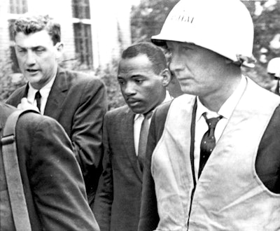 Federal marshals escorting James Meredith to class.