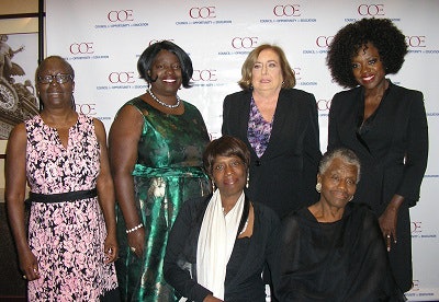 Viola Davis (right) and her family with Maureen Hoyler, president of COE.