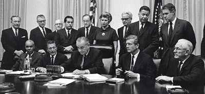President Lyndon B. Johnson at the signing of the 1968 Kerner Commission.