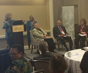Dr. Mildred Garcia makes remarks as Dr. Mary Evans Sias looks on with panelists Drs. Belle Wheelan, George Pruitt and Barbara Gellman-Danley.