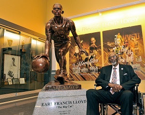 Earl Lloyd with his statue in WVSU’s convention center