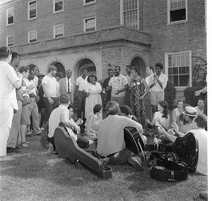 Freedom Summer workers and volunteers gather to sing outside of Clawson Hall (photo by George R. Hoxie; courtesy of Smith Library of Regional History).