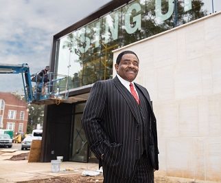 Talladega College President Dr. Billy C. Hawkins stands outside the new Dr. William R. Harvey Museum of Art during its construction period.