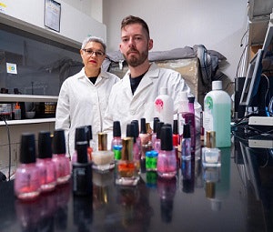 Dr. Lupita Montoya, left, and a student research toxins affecting nail salon workers.