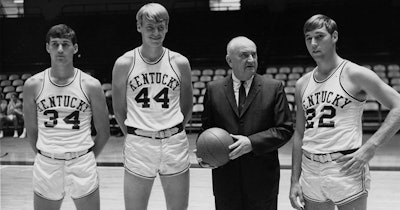 Adolph Rupp with players.