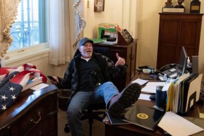 A Trump supporter takes over the office of Speaker of the House Nancy Pelosi.