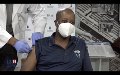 Dr. Wayne A. I. Frederick, president of Howard University, receives a COVID-19 vaccine