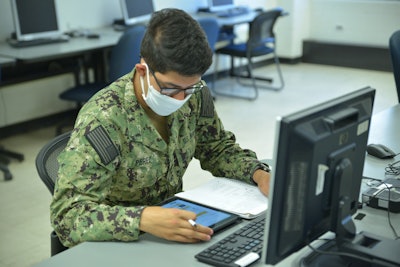 A sailor studies in the interactive courseware classroom to successfully pass Basic Engineering Common Core's at the Surface Warfare Engineering School Command.