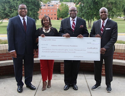 Alabama A&M leadership pose with a donation check totaling $2,187,518.75.