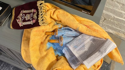 Blue laundry detergent was dumped on a Torah scroll in a vandalism incident at a George Washington University frat house.