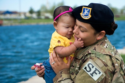 Air Force Senior Airman Ashley Dudley plays with her daughter at Whiteman Air Force Base in Missouri on May 4, 2018.