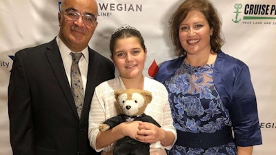 12-year-old Sawsan Ahmed with her father and mother.