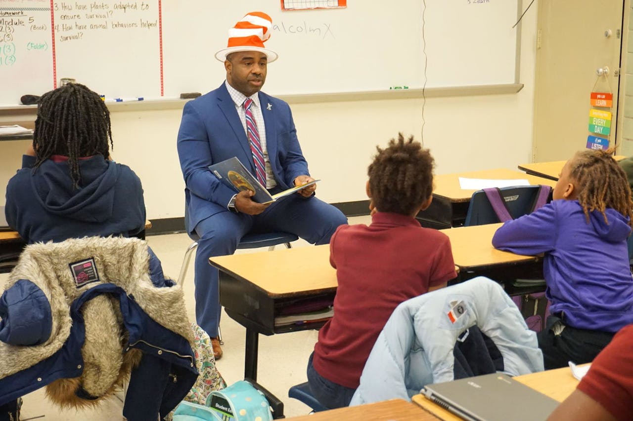 Dean Roland Mitchell reads to children at Buchanan Elementary in 2019.