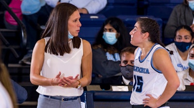 Coach Megan Griffith with Carly Rivera, a junior guard for Columbia University's basketball team.
