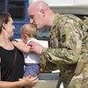 Mil Air National Guardsman Kisses Baby 1800