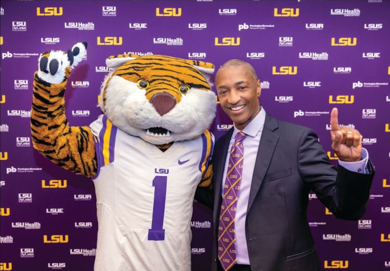 Dr. William F. Tate IV, LSU's president, with Mike the Tiger, LSU’s mascot.