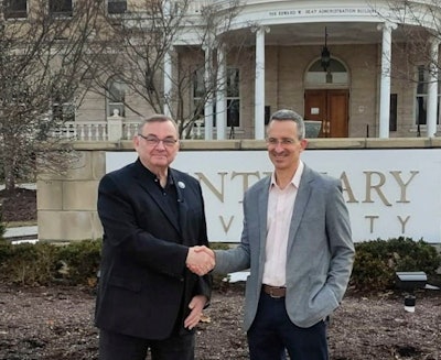 Bruce Murphy, president of Centenary University, left, shakes hands with Dr. Tal Ben-Shahar, right.