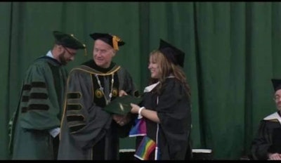 A screenshot of the moment Samantha Lynn Motto walked across the stage wearing her pride gear. This moment was later edited out from the official video shared by the school.