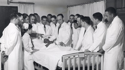 Dr. Charles Drew instructs Howard University interns during rounds.