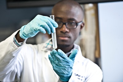 A student works in the lab as part of studies in Howard University’s College of Pharmacy.