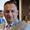 Higher education leaders say Dr. Steven R. Gonzales (center) brings a unique-but-relatable perspective to serving first-generation and underprivileged students as chancellor of the Maricopa County Community College District.