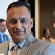 Higher education leaders say Dr. Steven R. Gonzales (center) brings a unique-but-relatable perspective to serving first-generation and underprivileged students as chancellor of the Maricopa County Community College District.